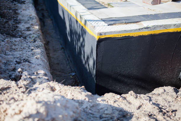Professional Waterproofing technician working in Ghent, KY